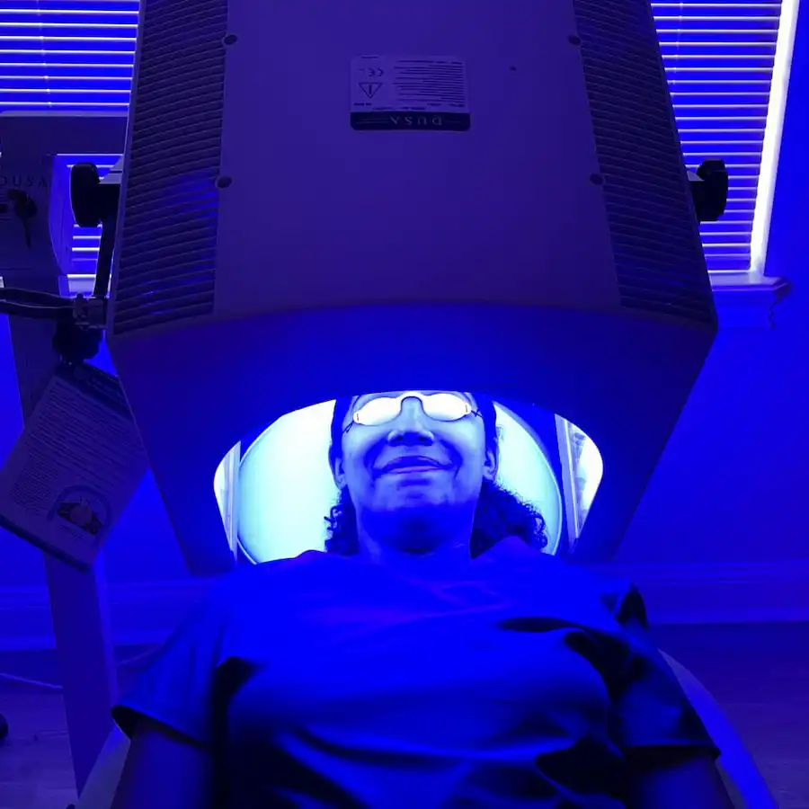 Patient receiving blue light photodynamic therapy at St. Louis Dermatology & Cosmetic Surgery